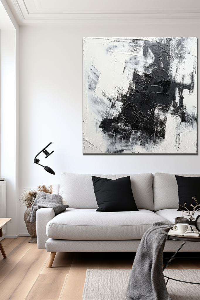 A stunning black and white painting hangs above a couch, elevating the space in the living room.