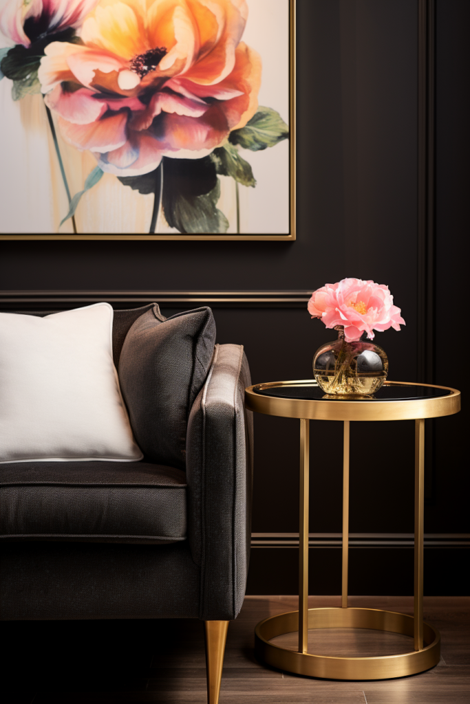 A modern and minimalist black and gold living room exuding streamlined serenity. The clean design elements are accentuated by a captivating painting adorning the wall.