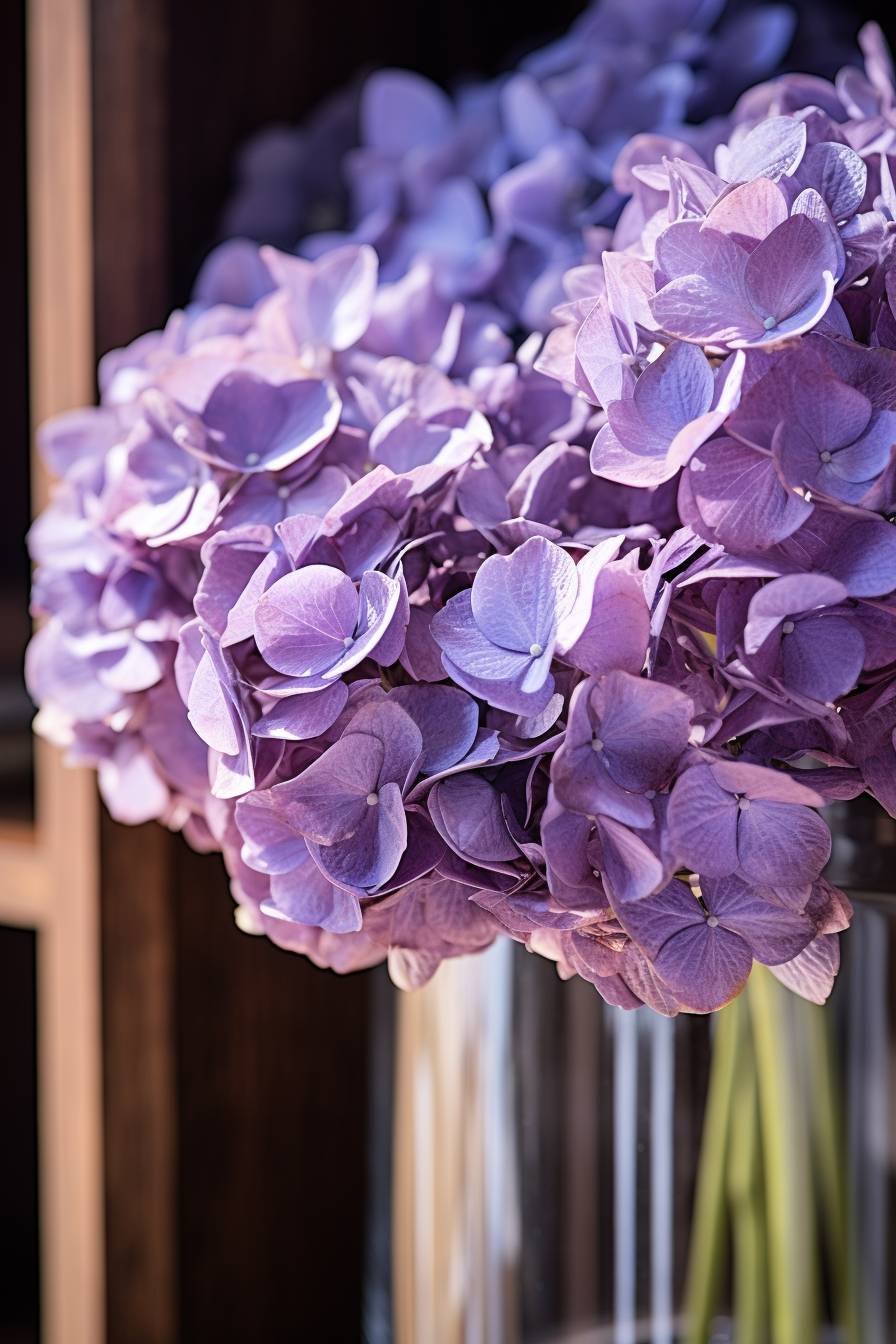 Elegant purple flowers in a modern minimalist living room vase.