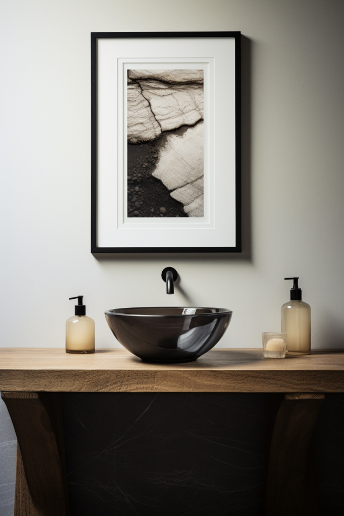 A bathroom with a timeless charm and a black and white framed print.